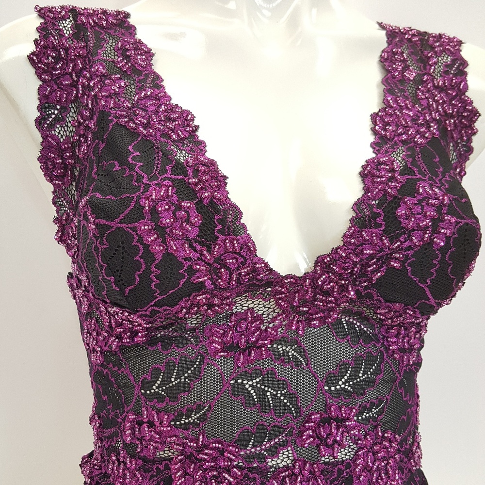 Decorated lace top blouse in purple black color.